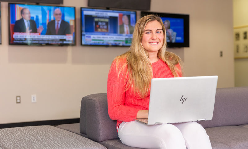 Faith Guzzo with computer