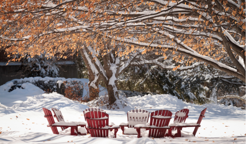 Snow covered outdoor chairs